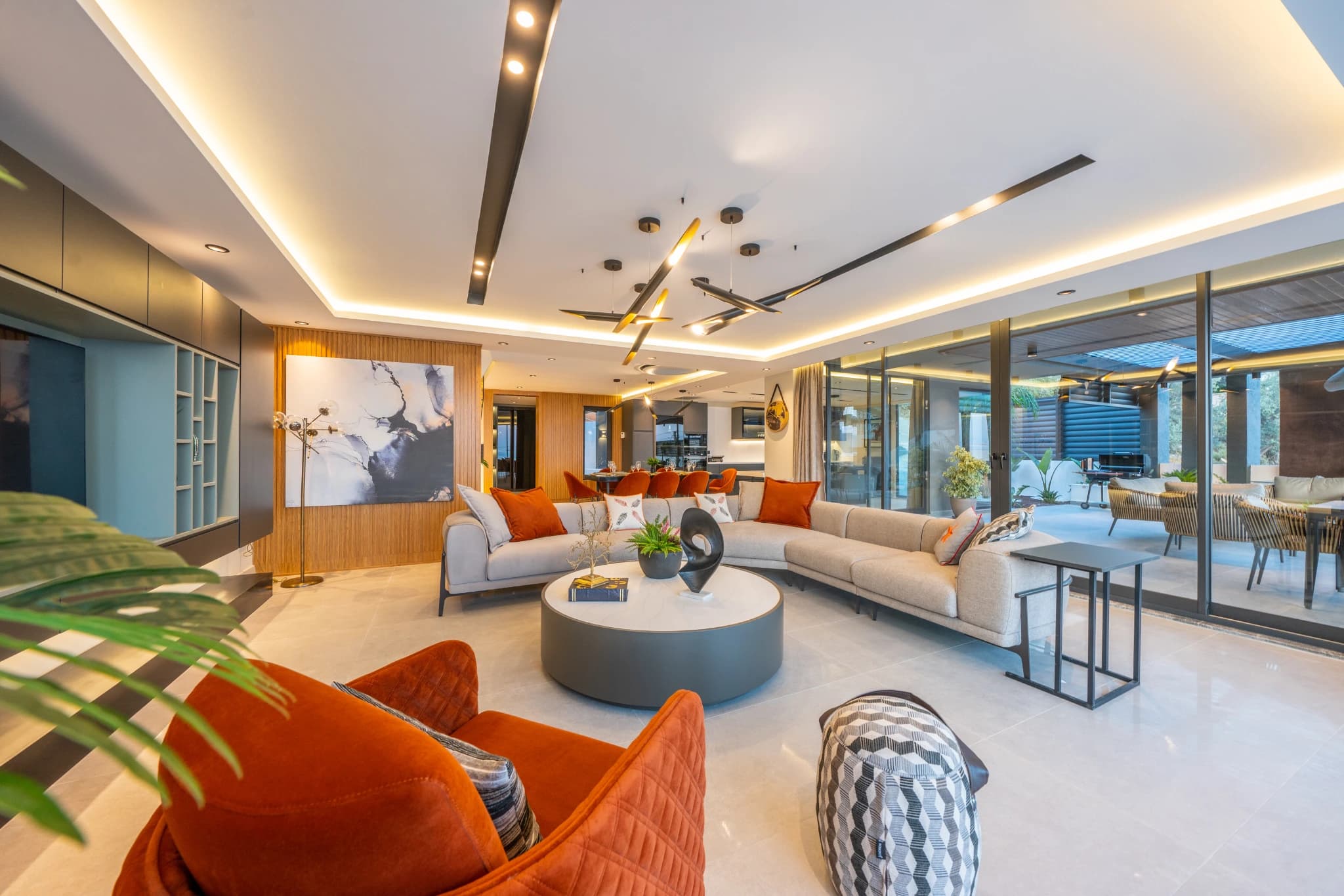 Spacious modern living room with panoramic sea views and contemporary furnishings.