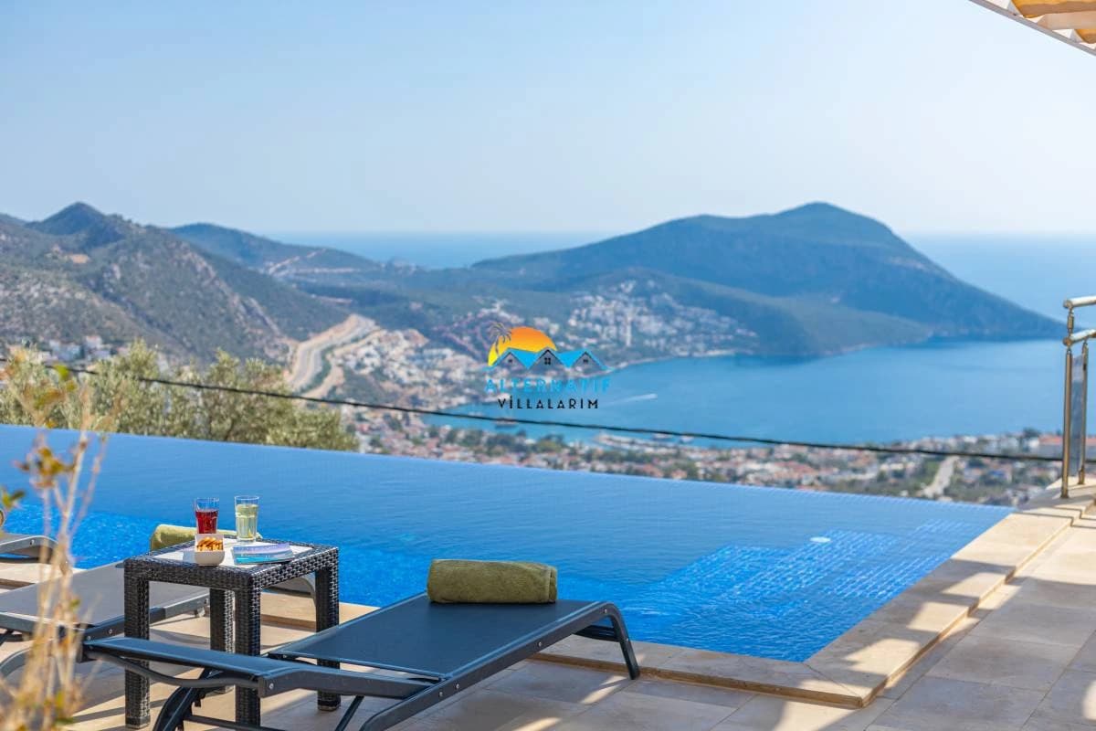 Stunning private pool overlooking the Mediterranean coast with mountain and sea views.