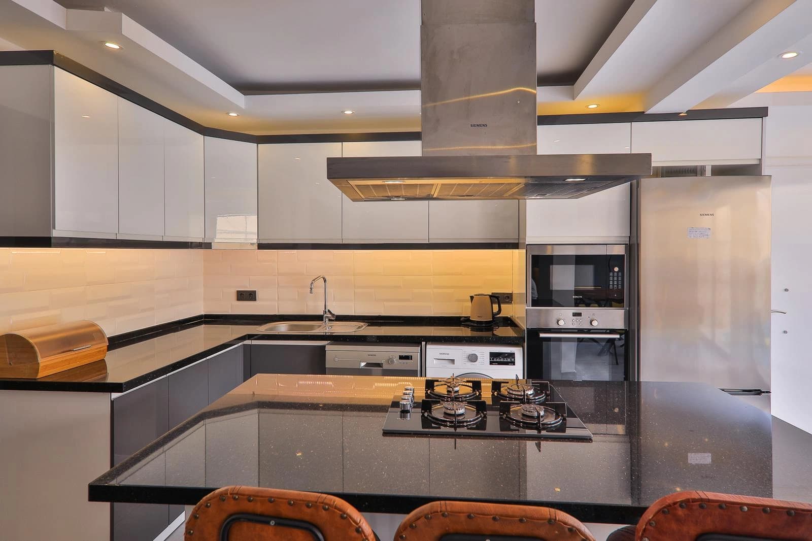 Kitchen showing the premium appliances and counter layout.