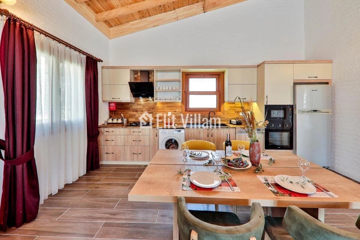 Kitchen and dining space with wooden accents and prepared table setting.