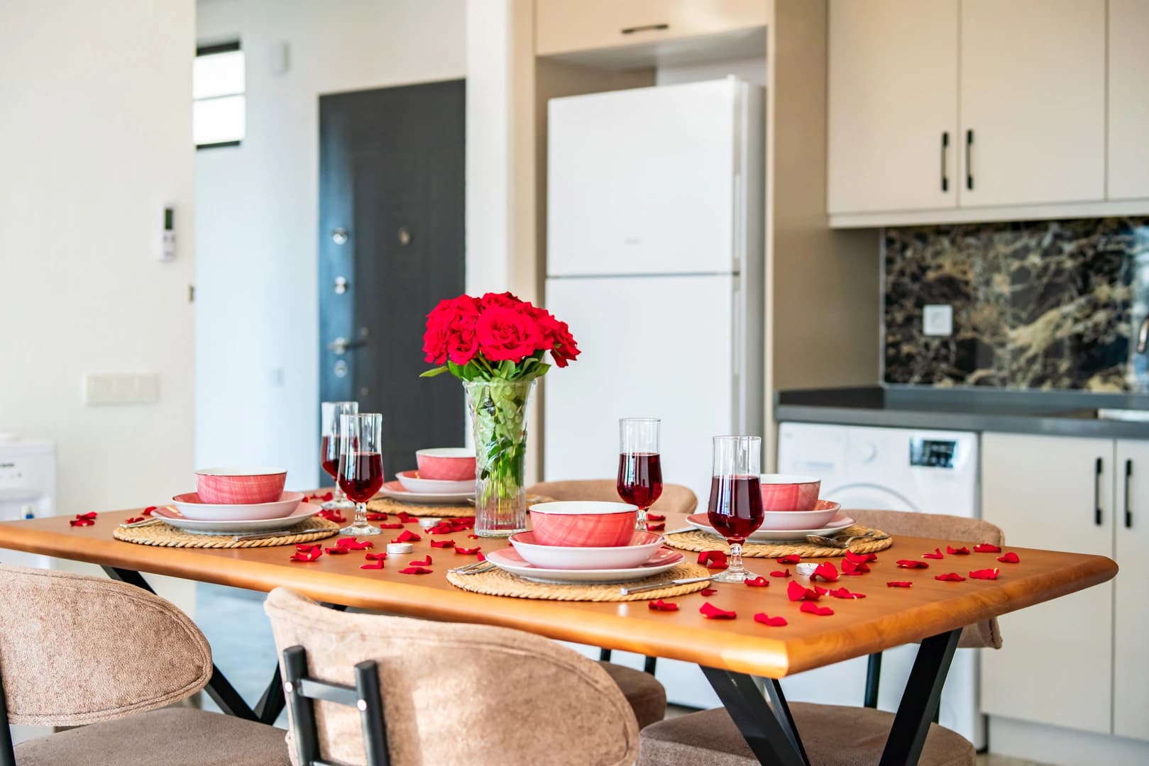 Spacious dining table in bright kitchen-dining space with contemporary styling.
