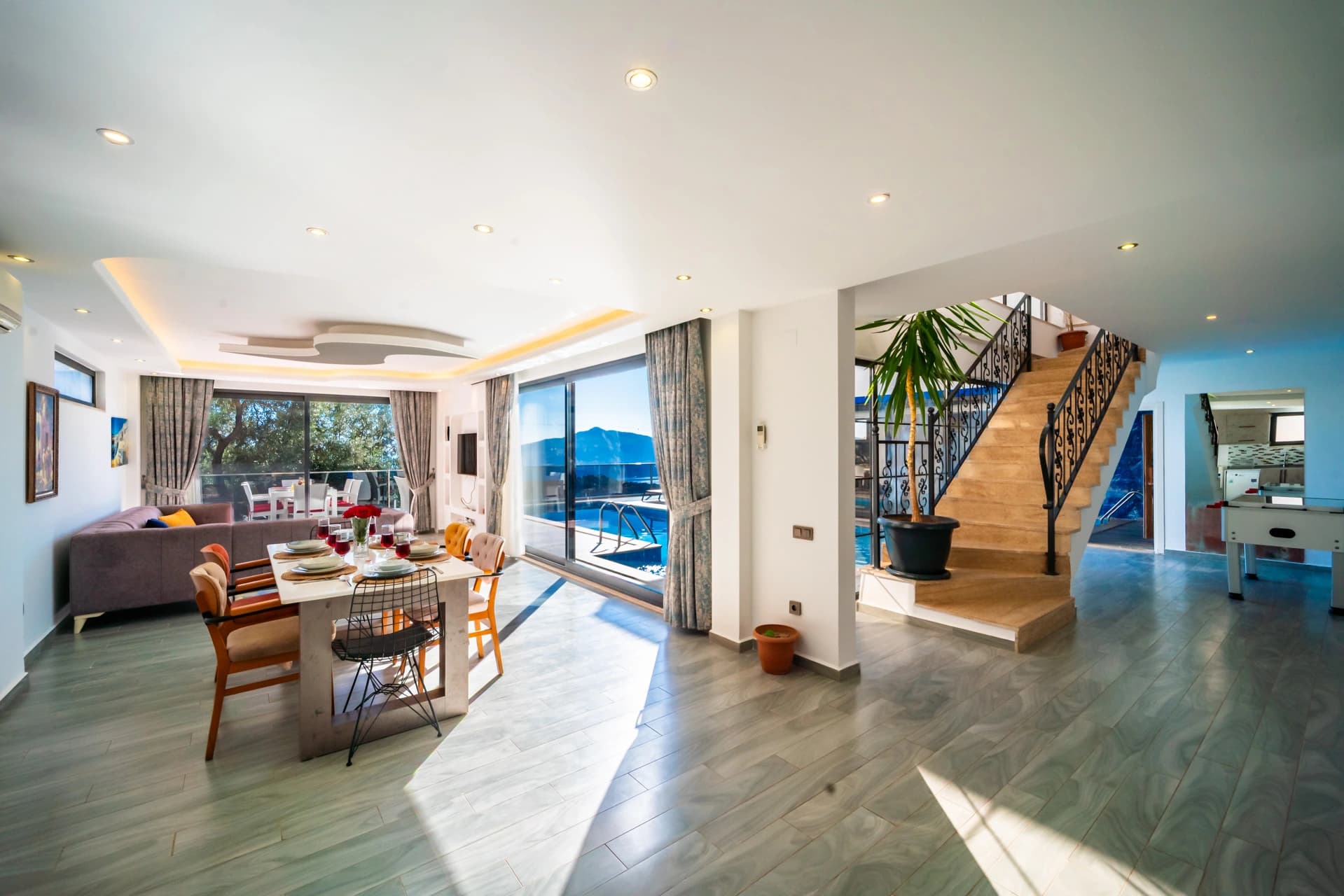 Bright open-plan living space with panoramic sea views and luxury finishes.