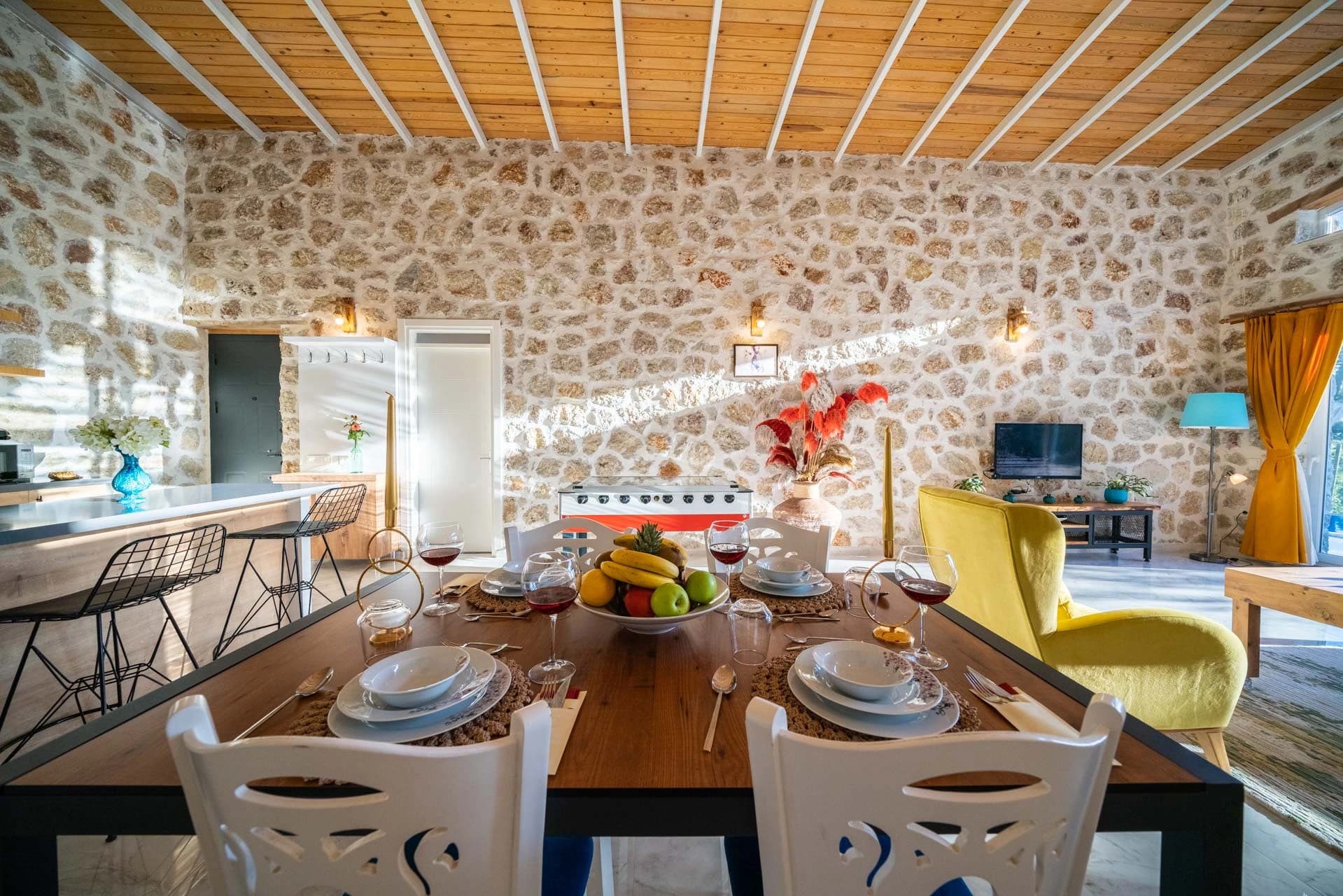 Elegant dining area with wooden table and connection to living spaces.