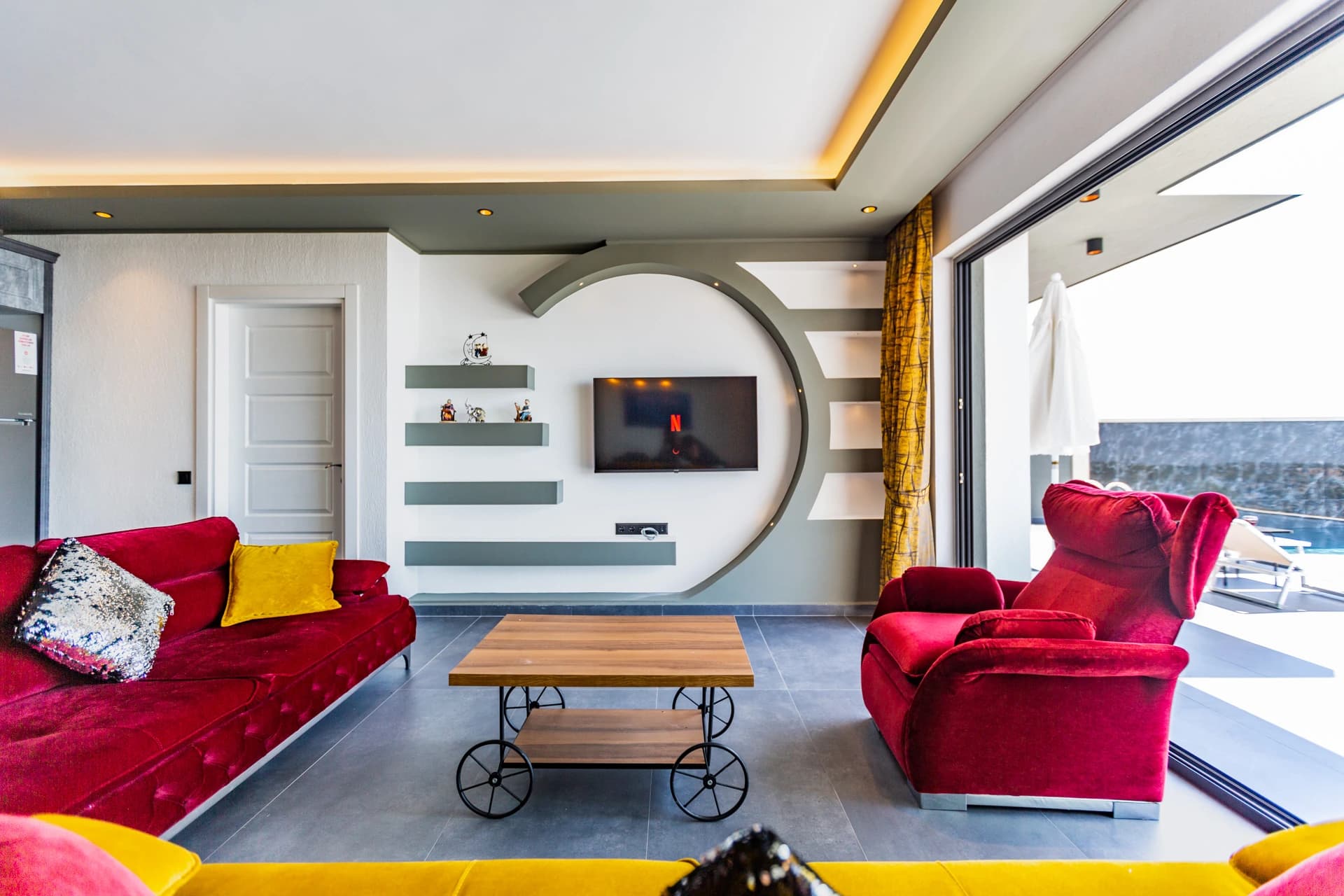 Living room with expansive sea views and contemporary seating overlooking the coast.