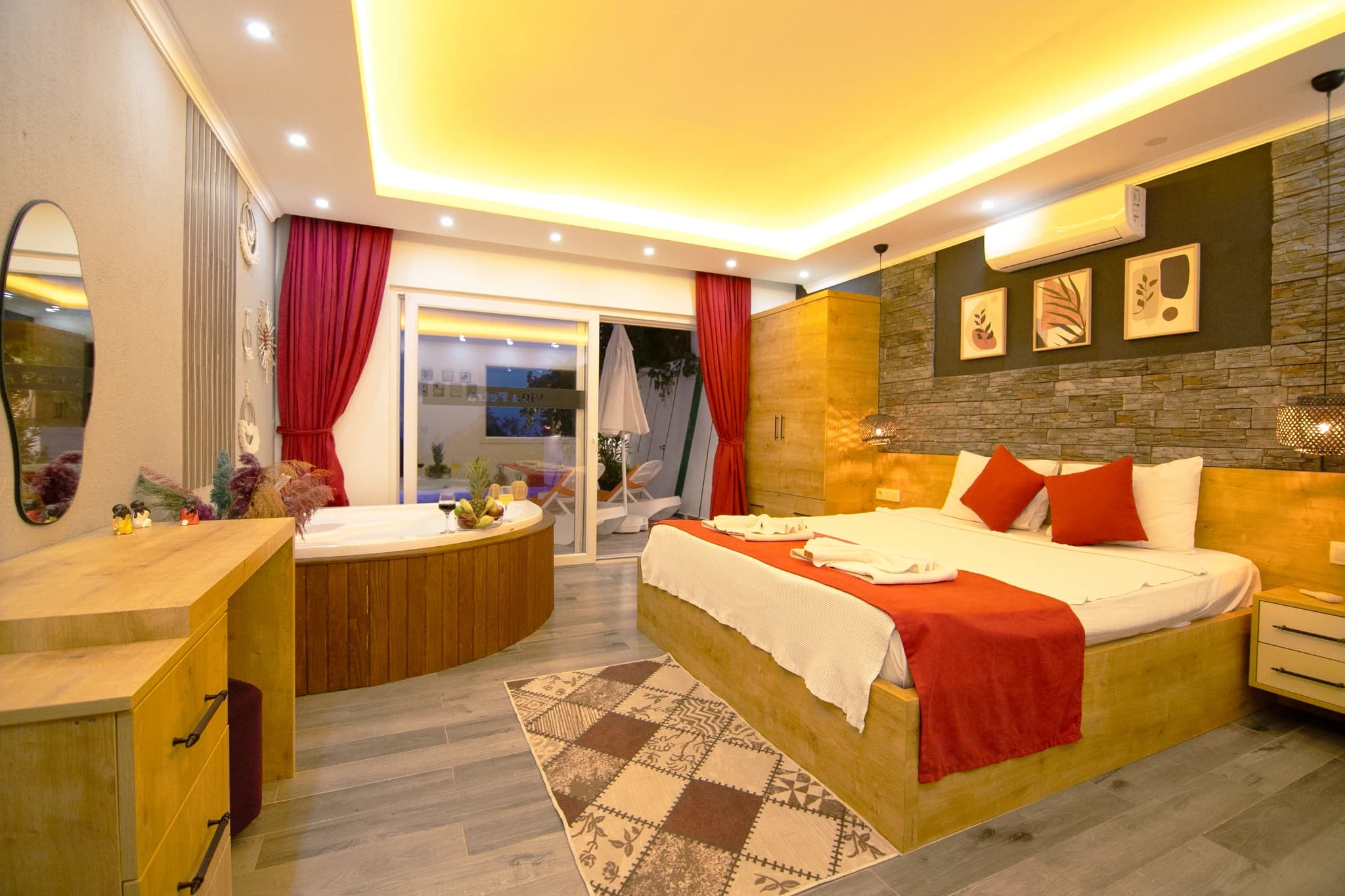 Luxurious master bedroom with king bed, ensuite bathtub, and private balcony access.
