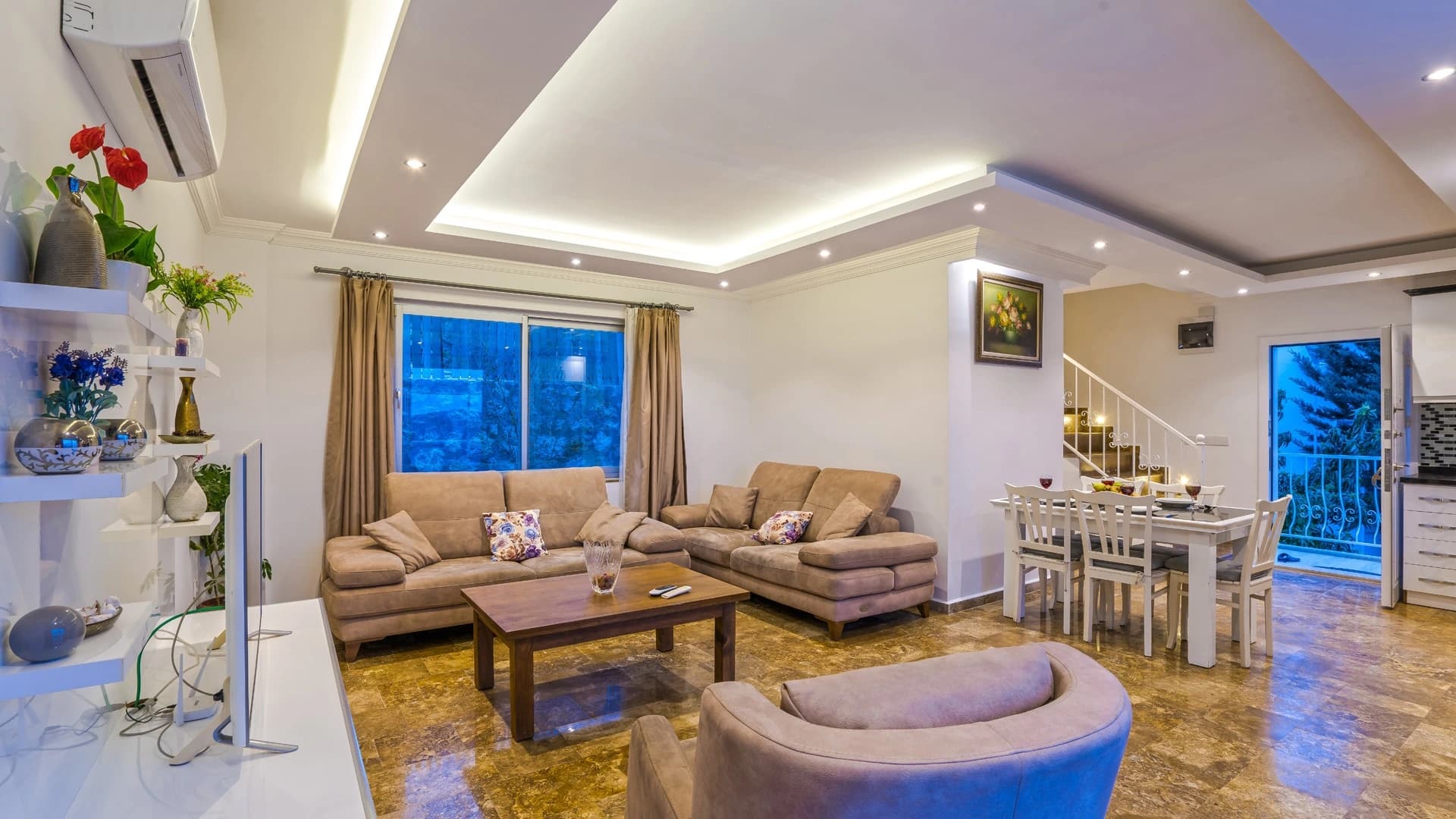 Secluded Nature Retreat Villa with Heated Pool and Sea & Mountain Views in Kalkan – Spacious modern living room with panoramic windows and connected dining area.